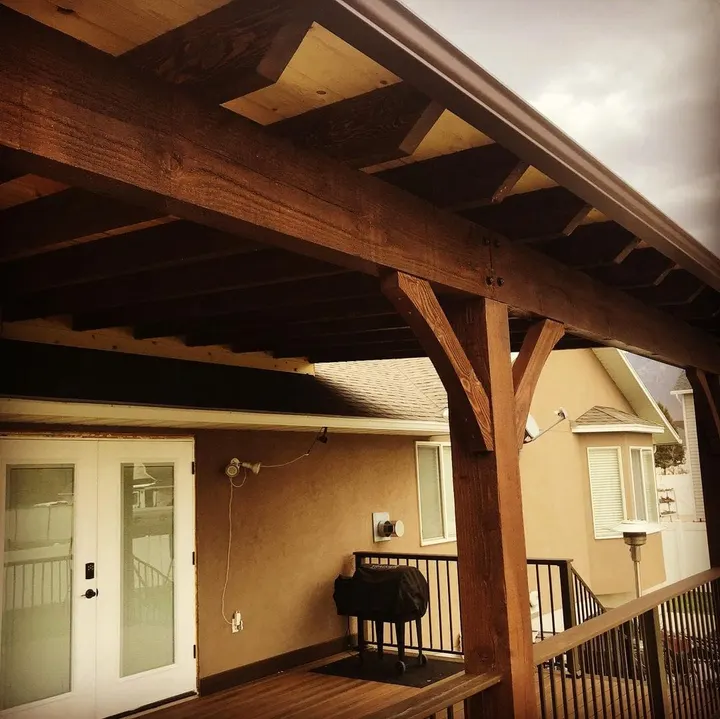 Close view of an attached patio cover beam and brace