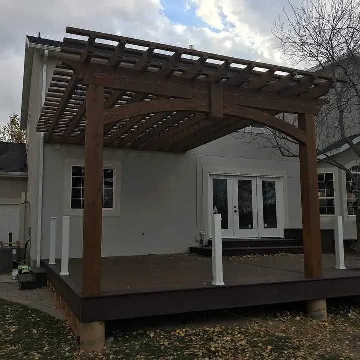Attached open-lattice pergola over a small entry deck