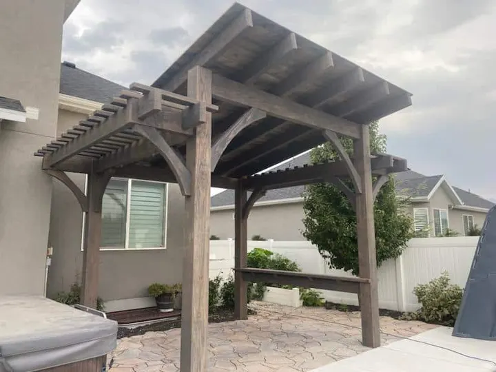 Attached pergola over a paved patio