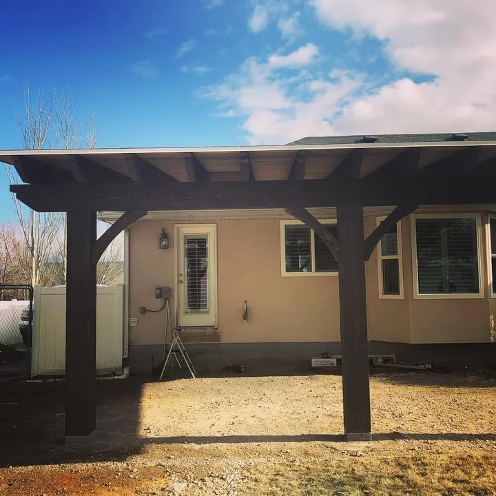 Wide attached patio cover viewed from the yard