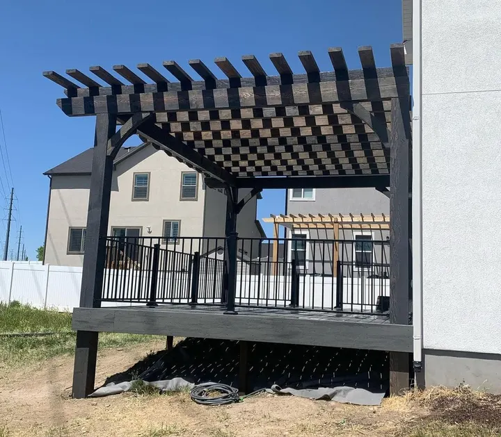 Deck pergola with a checkerboard lattice roof pattern