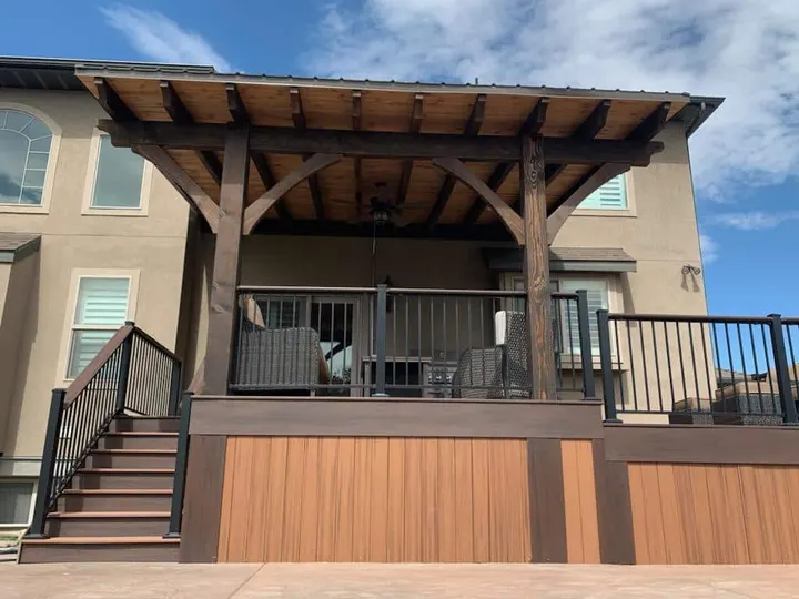 Roofed structure over an elevated backyard deck