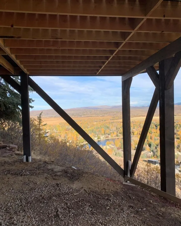 Timber patio cover framing an elevated hillside view