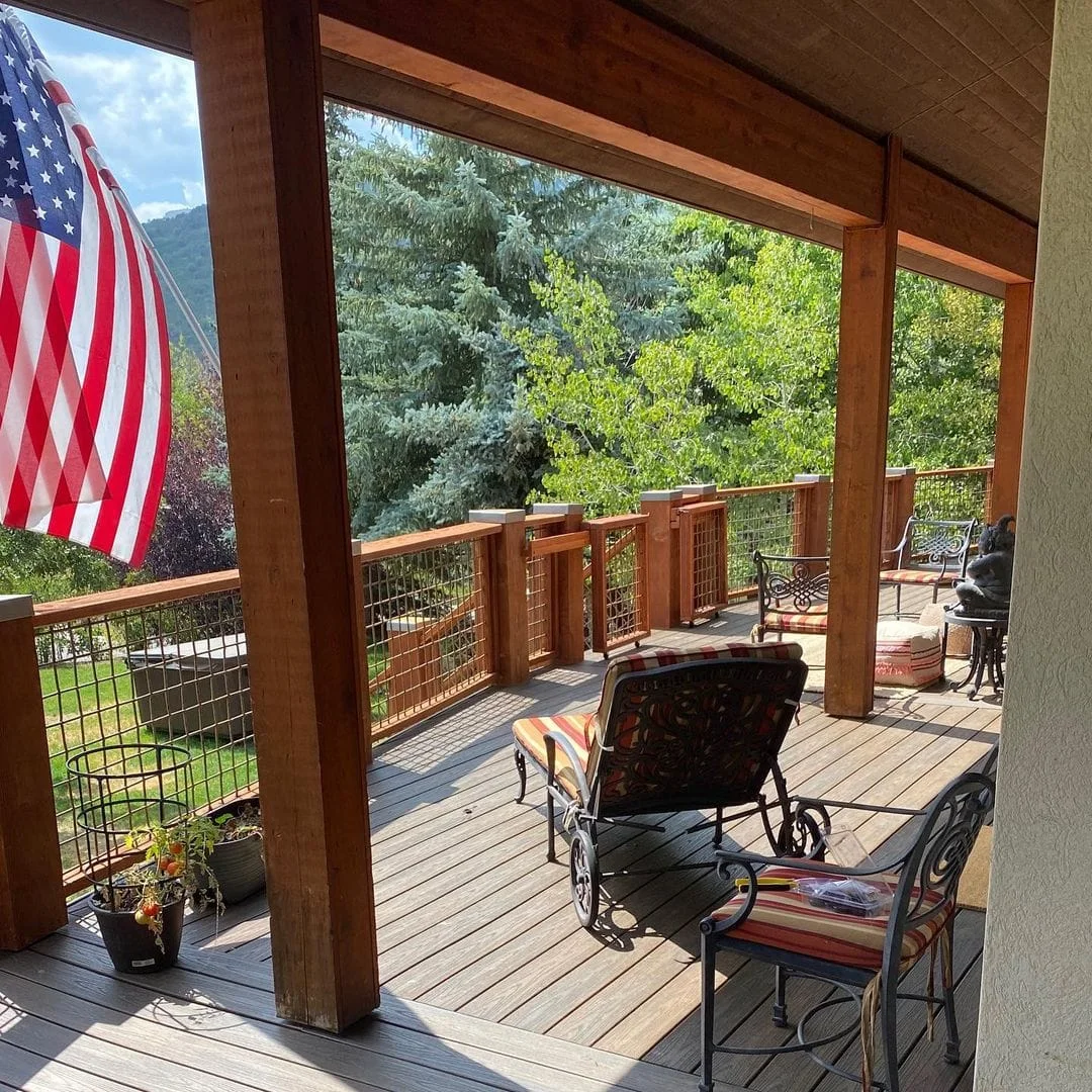 Solid-roof timber cover over a raised deck seating area