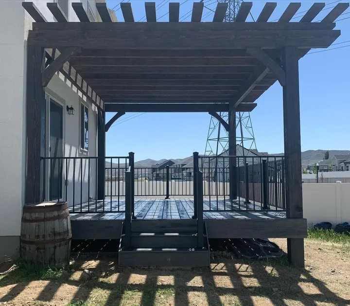 Covered raised deck with central stair entry