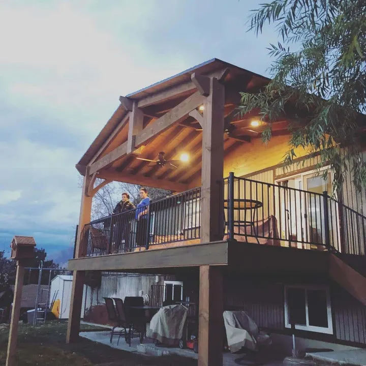 Elevated deck with illuminated timber ceiling