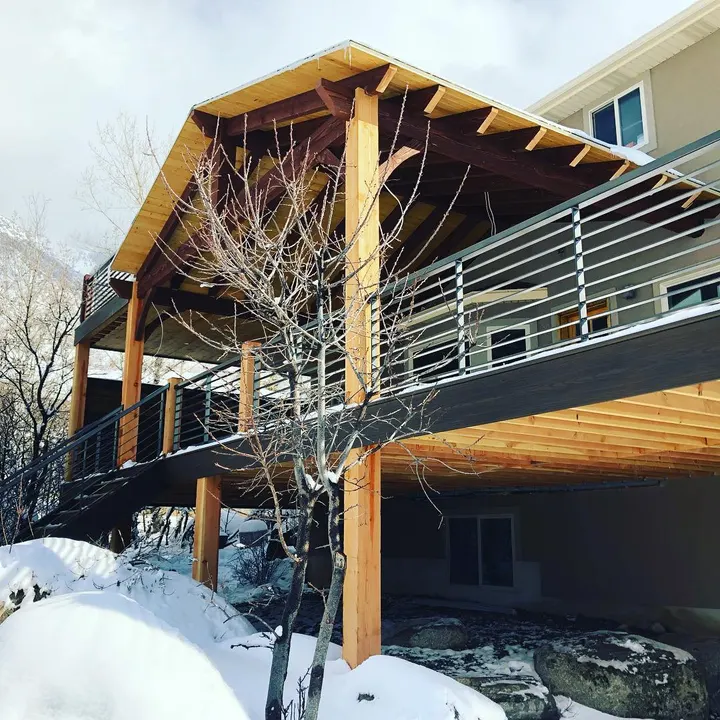 Elevated deck with horizontal metal railing