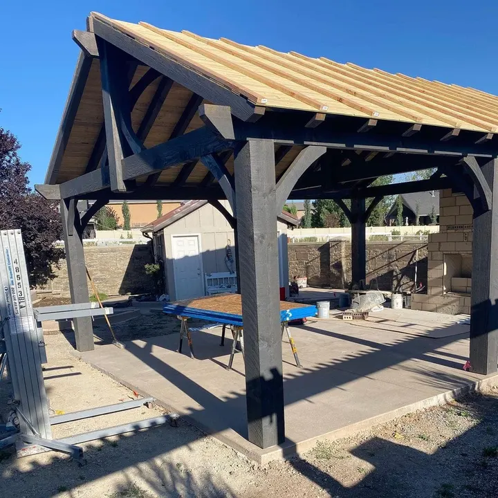 Gabled pavilion under construction over a deck