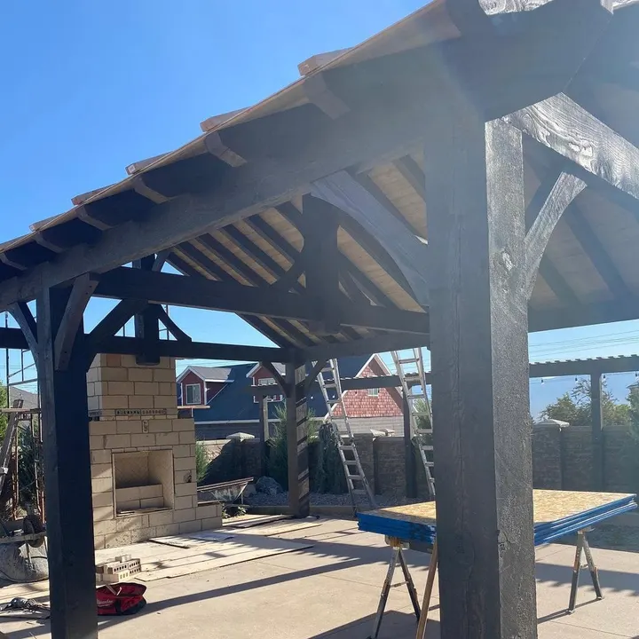 Close view of a timber pavilion post and roof truss