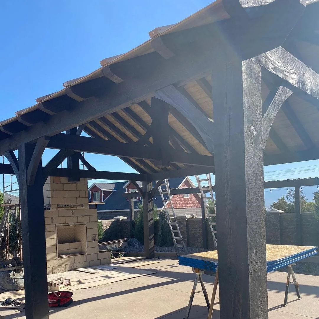 Close view of a substantial timber pavilion post and roof truss