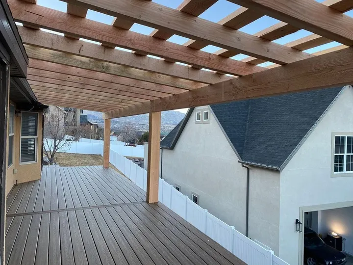 Open-lattice timber cover over an upper-level deck