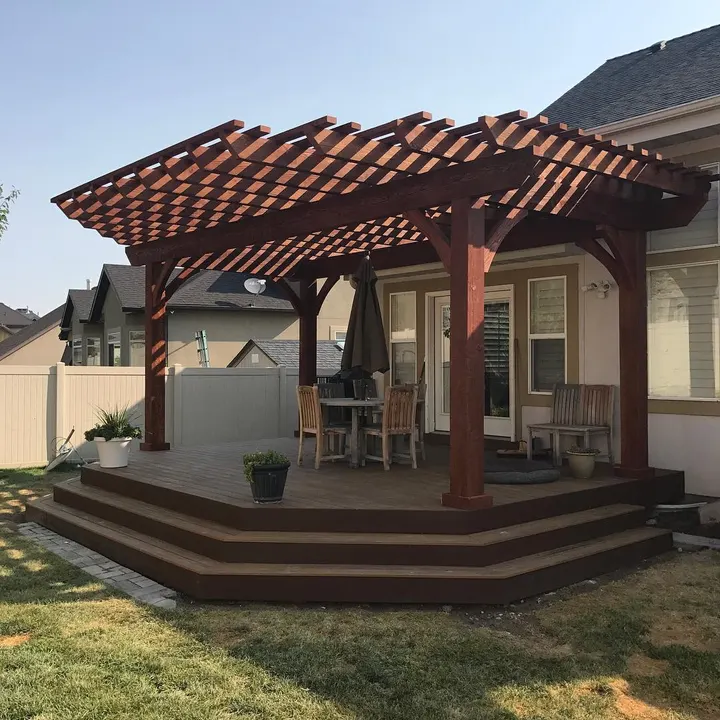 Open-lattice pergola covering a corner deck seating area