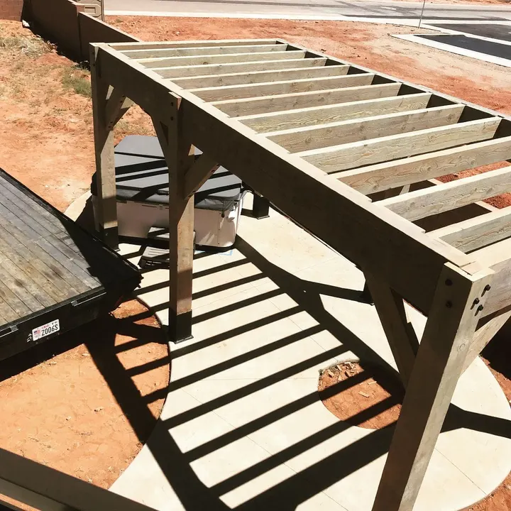 Close view of pergola beams and lattice shadows