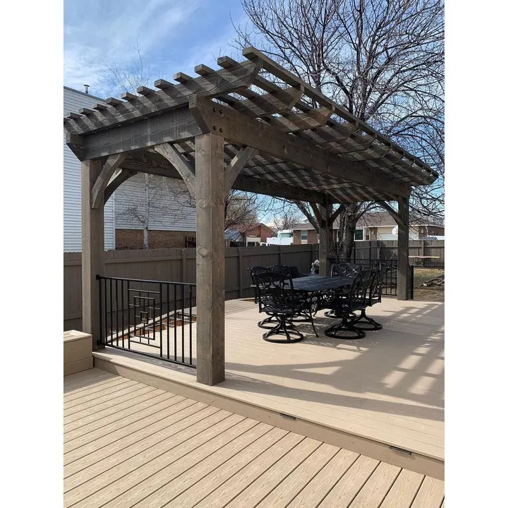 Raised deck pergola with outdoor dining furniture