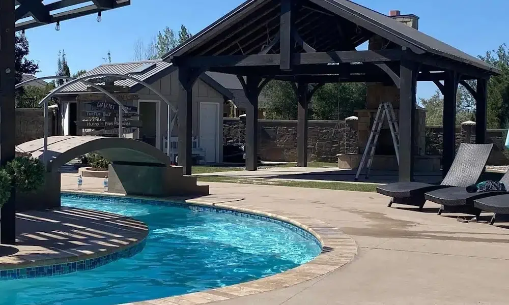 Timber pavilion beside a swimming pool