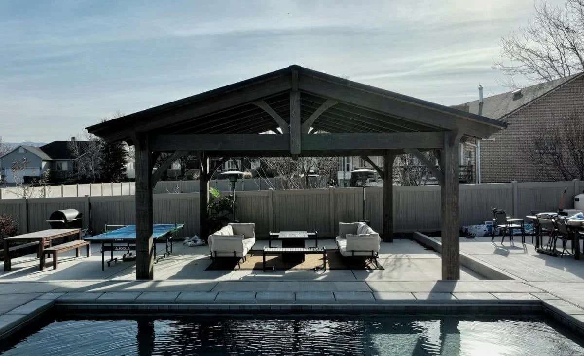 Finished timber pavilion beside a residential pool